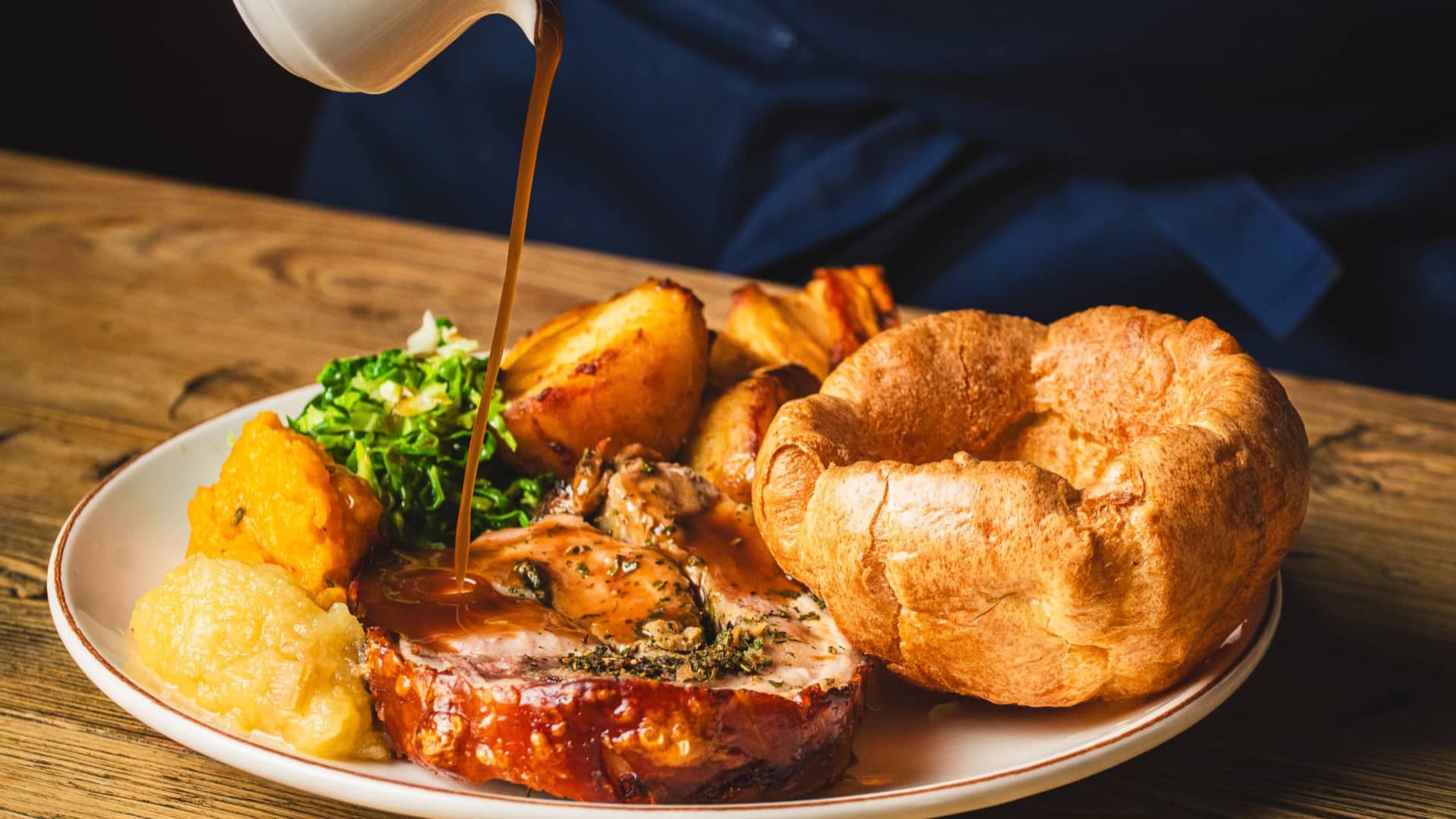 Gravy being poured over Roast Dinner